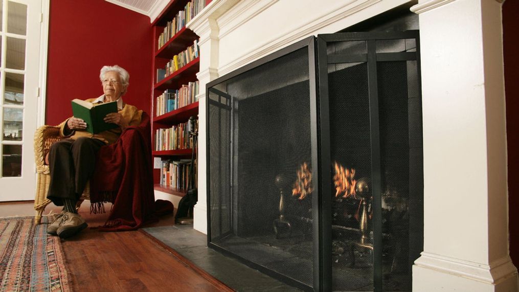 FILE IMAGE - A file image of a woman sitting by a fire place. (Photo: U.S. Fire Administration)