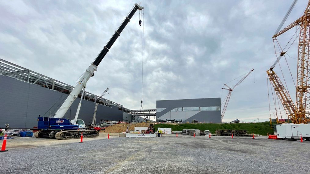 Construction continues on the Wolfspeed factory in Siler City, N.C., on March 26, 2024. The new factory will soon produce advanced wafers for computer chips. Automaker Vinfast is scheduled to open a factory next year. Both projects stem in large part from incentives that Biden signed into law. Biden has campaigned on how his policies helped pump hundreds of billions of dollars in private and federal investment into companies. But so far, the investments havenât significantly swayed a public concerned about inflation. (AP Photo/Josh Boak)