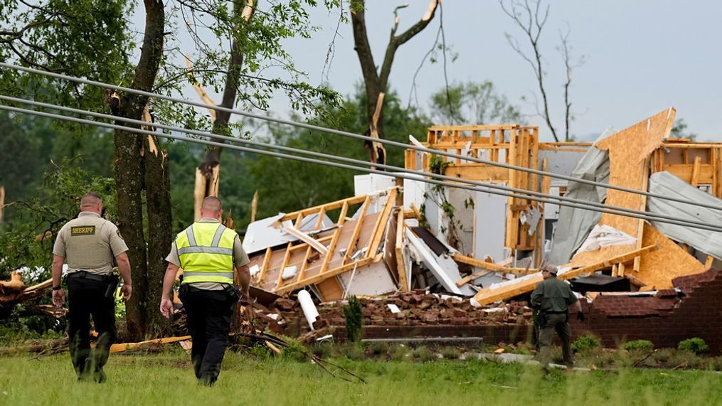 Maury County Sheriffs Deputies search through a storm damaged home along Blackburn Lane, Thursday, May 9, 2024, in Columbia, Tenn. Severe storms tore through the central and southeast U.S., Wednesday, spawning damaging tornadoes, producing massive hail, and killing two people in Tennessee. (AP Photo/George Walker IV)