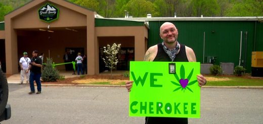 Casey Stuart holds a sign outside of Great Smoky Cannabis Dispensary on its opening day on April 20, 2024. Stuart was among those in line to see inside North Carolina's first medical cannabis dispensary. (Photo: WLOS Staff)